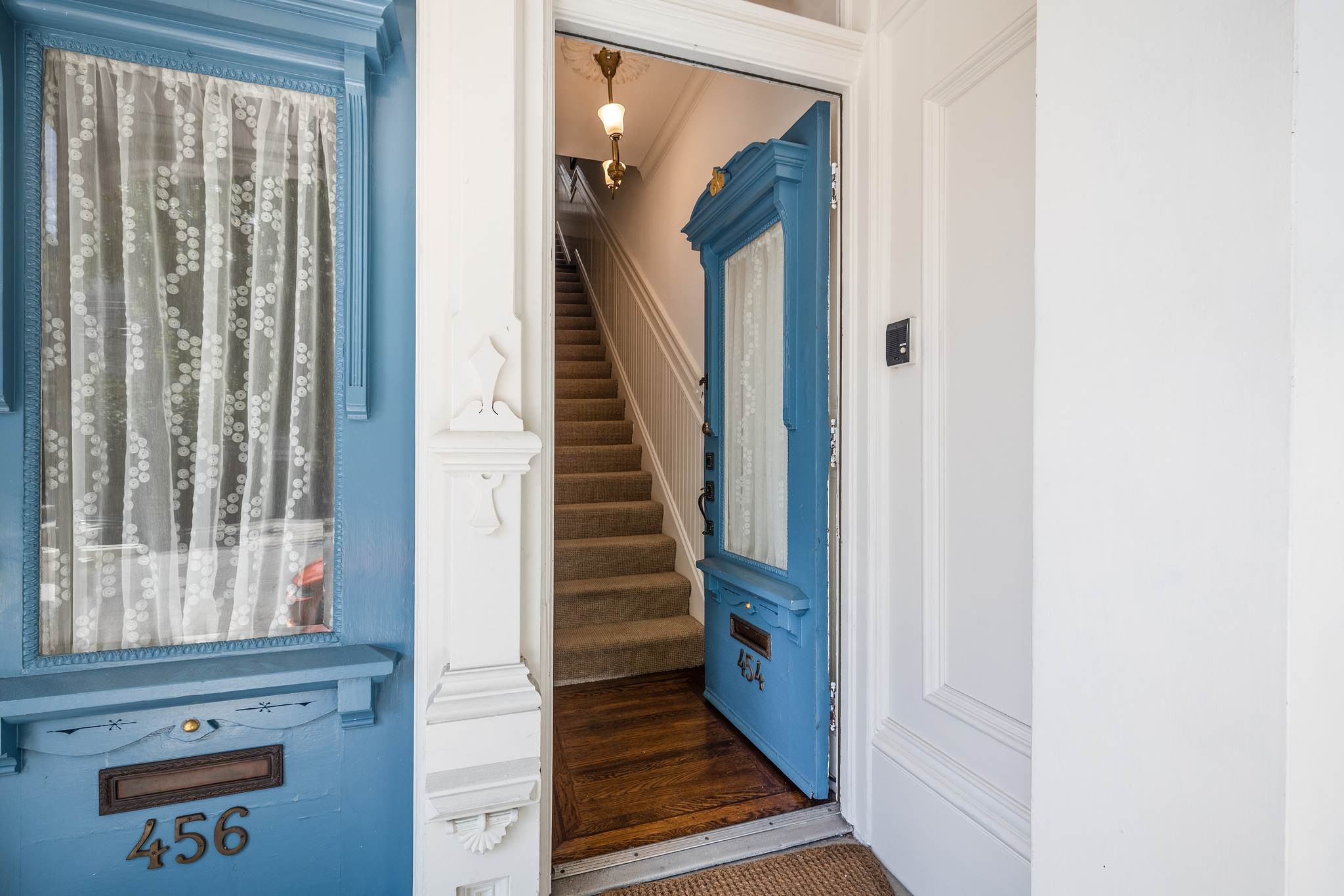 Property Photo: Front door to 454 Frederick Street stands open, showing stairs leading upwards