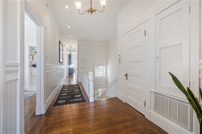 Property Thumbnail: Hallway with wood floors and white walls