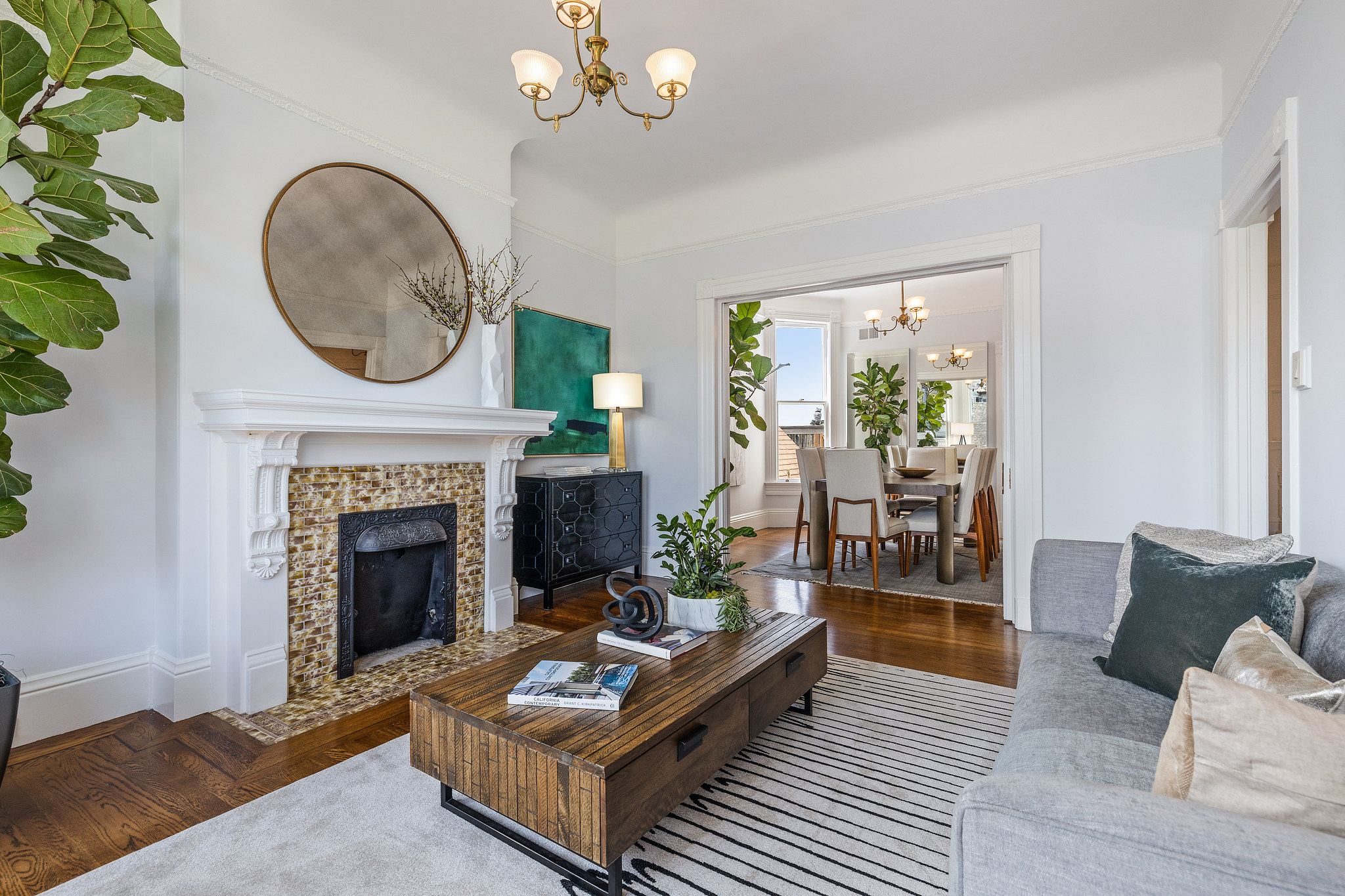 Property Photo: Living room at 454 Frederick Street, showing a fireplace and view into the dining area