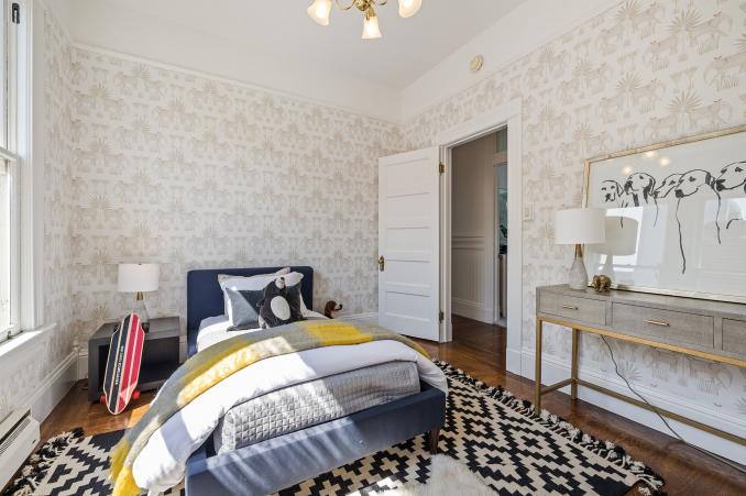 Property Thumbnail: View of the bedroom with tan and white wall-paper 