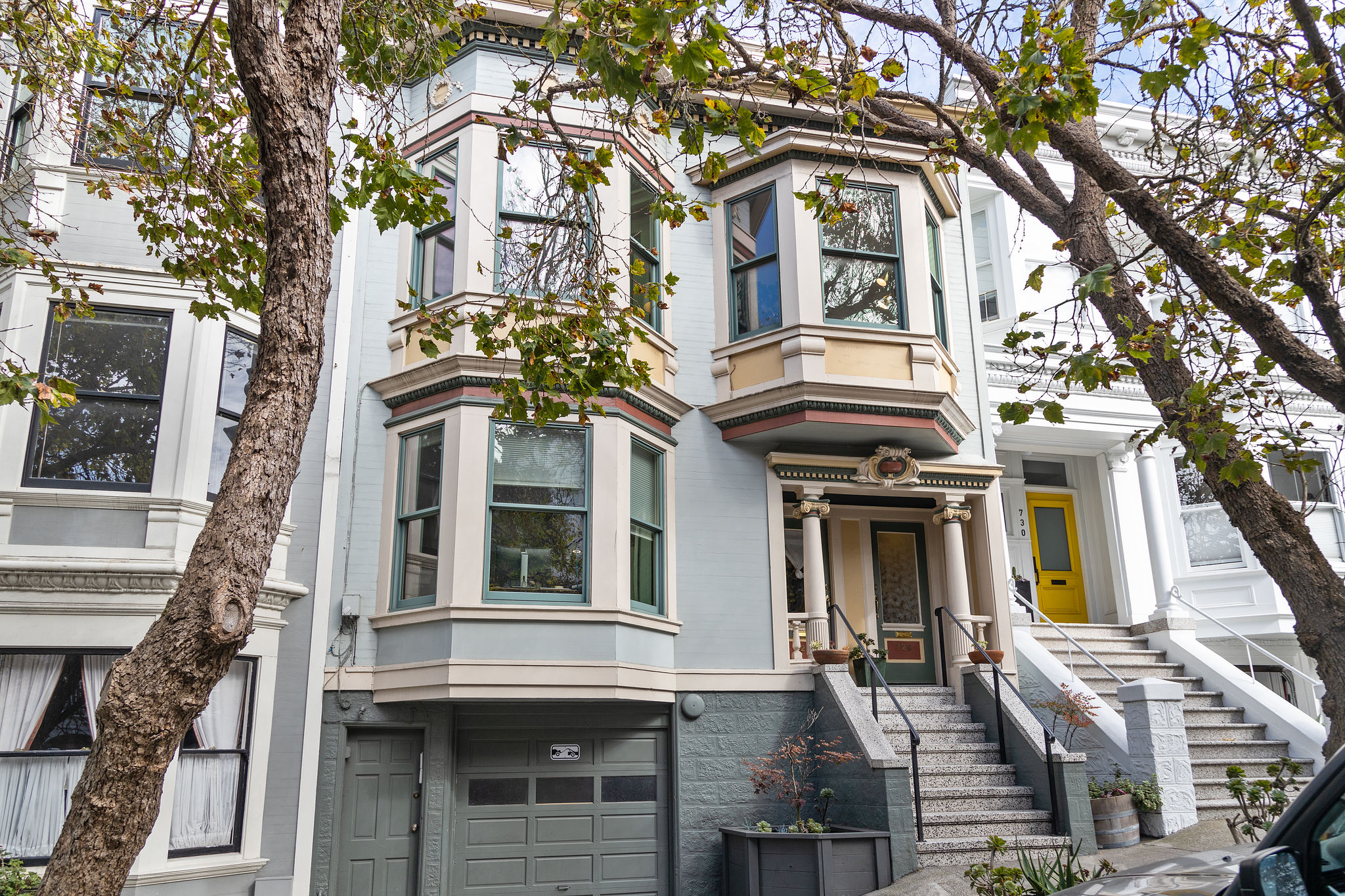 Property Photo: Exterior view of 726 Clayton Street, featuring a light blue Victorian home