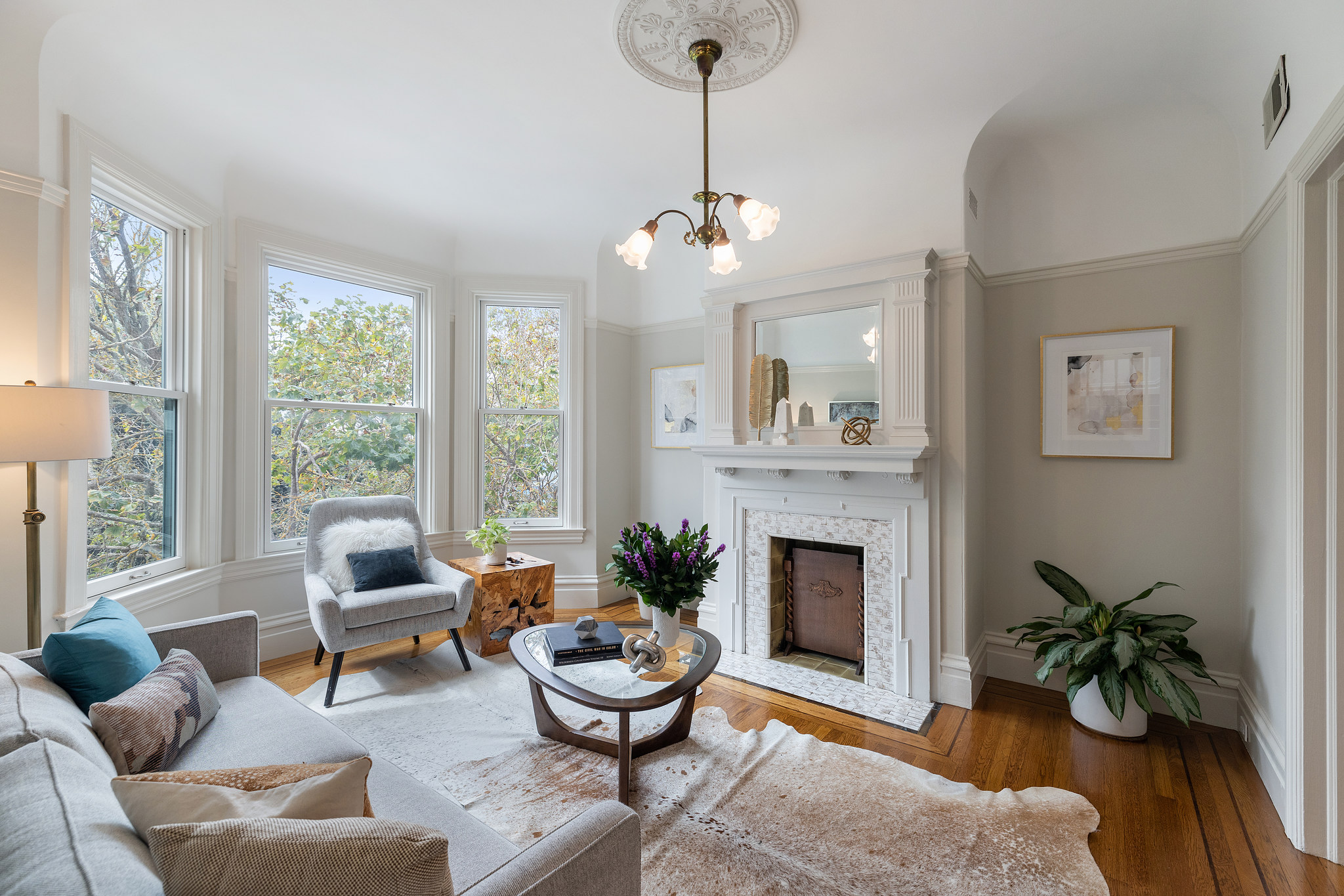 Property Photo: View of the living room at 726 Clayton Street, featuring a fireplace