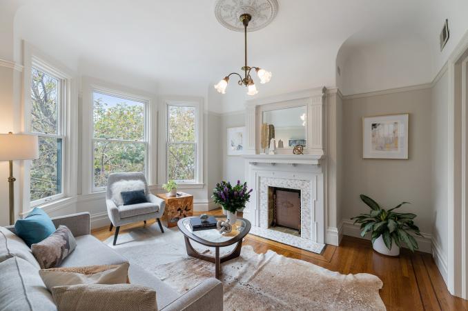 Property Thumbnail: View of the living room at 726 Clayton Street, featuring a fireplace