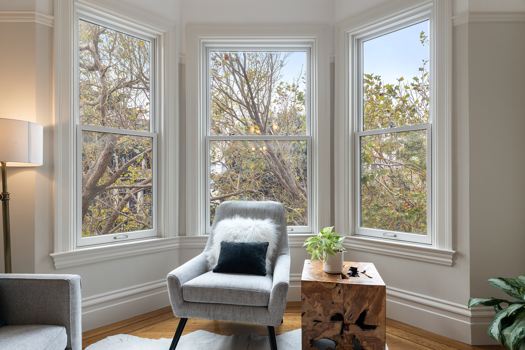 Property Photo: Seating area near three large windows