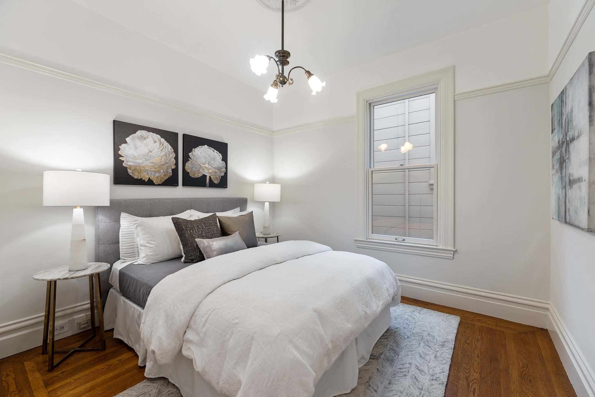 Property Photo: Bedroom with large window at 726 Clayton Street