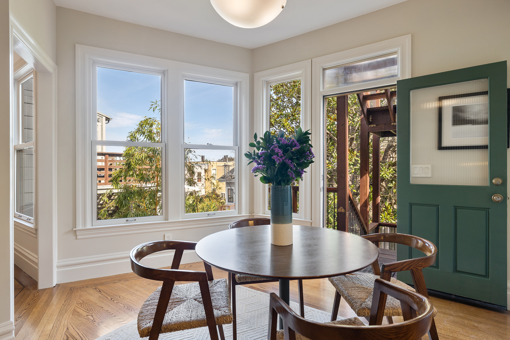 Property Photo: Close-up of the table with a view of San Francisco via the large windows