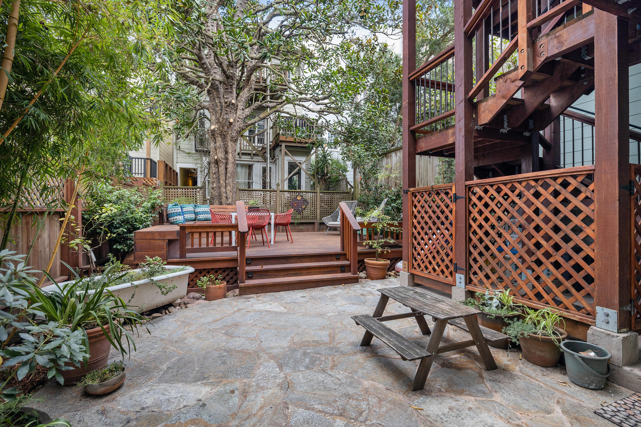 Property Photo: Stone patio and wood deck 