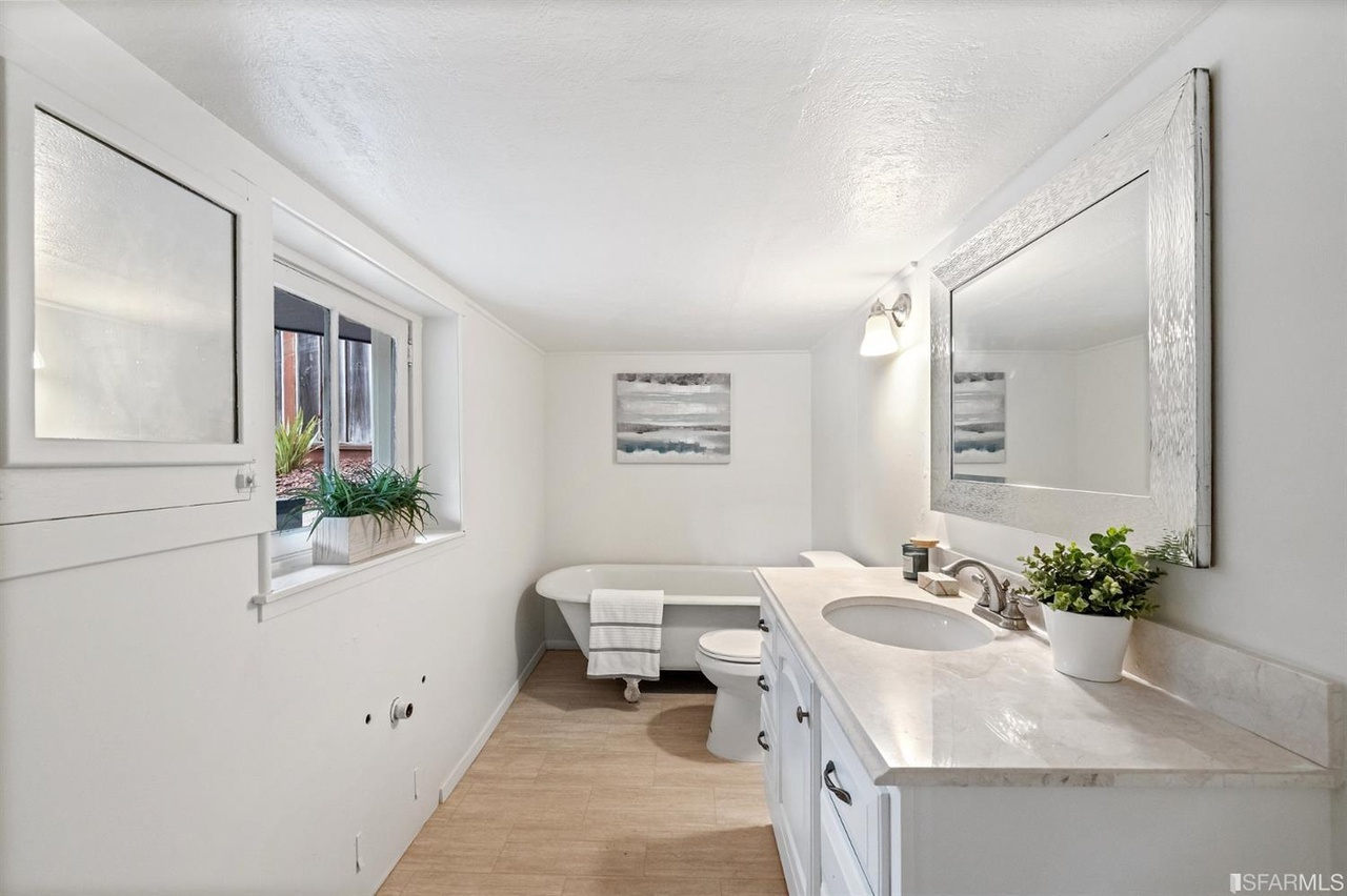 Property Photo: Lower bathroom, featuring a free-standing bath