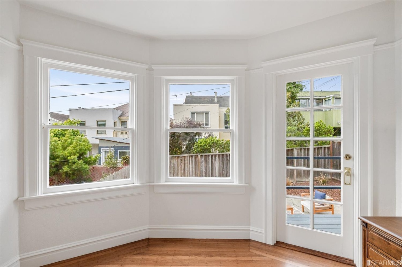 Property Photo: Two windows and a door provide a partial view of the yard at 78 Wawona Street
