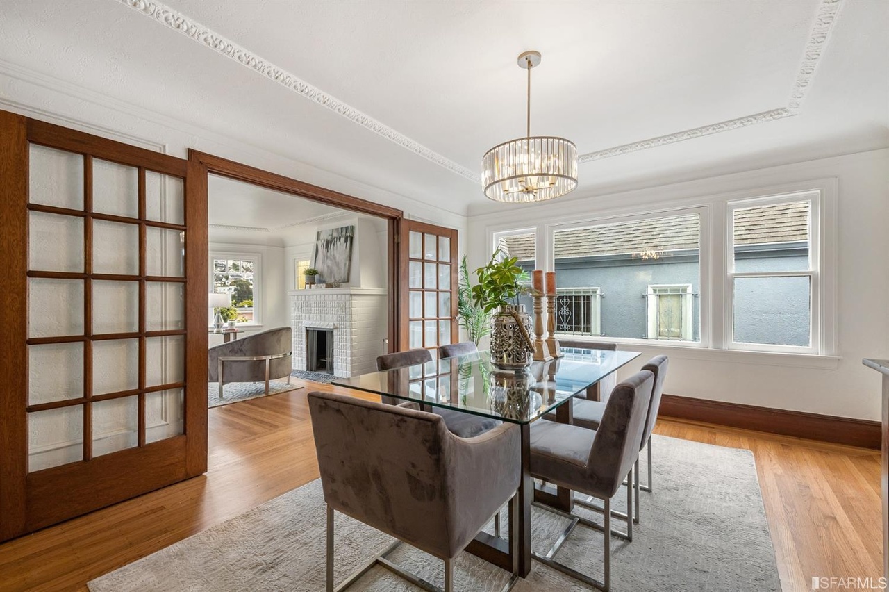 Property Photo: Dining room at 78 Wawona Street, featuring large wooden French doors