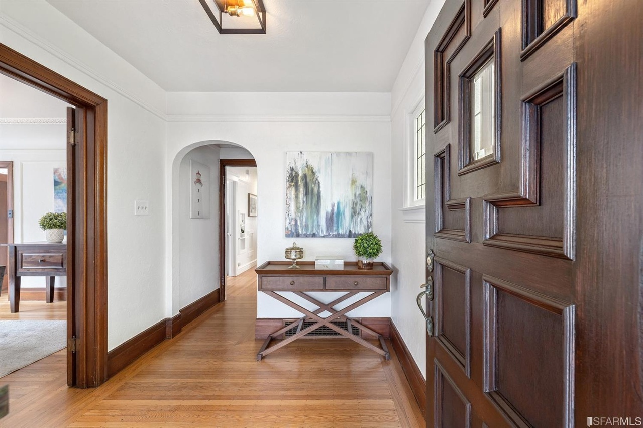 Property Photo: Entryway of 78 Wawona Street, showing wood floors and an arched hallway 