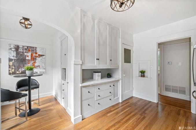 Property Thumbnail: Eat-in kitchen area and white built-in cabinets 