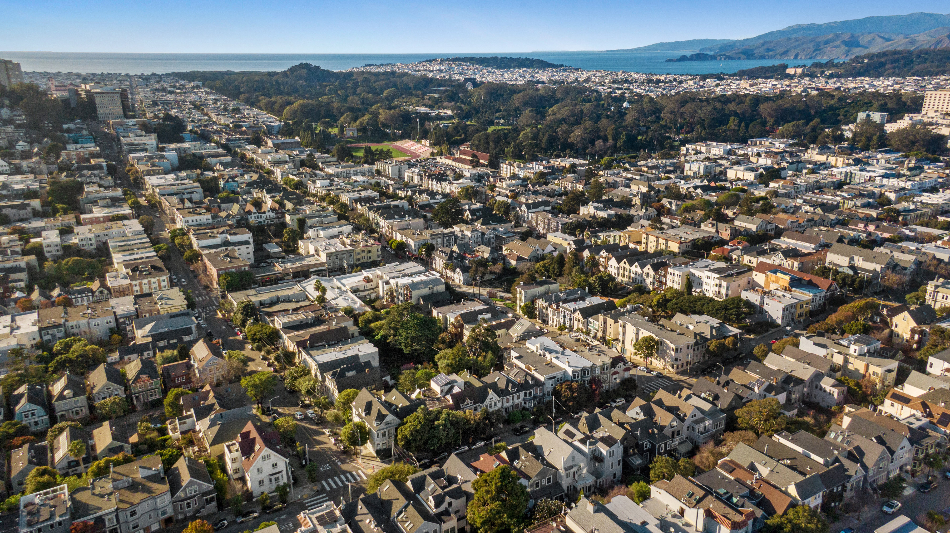 Property Photo: View of Golden Gate Park and the Bay, as seen via drone from 856 Clayton
