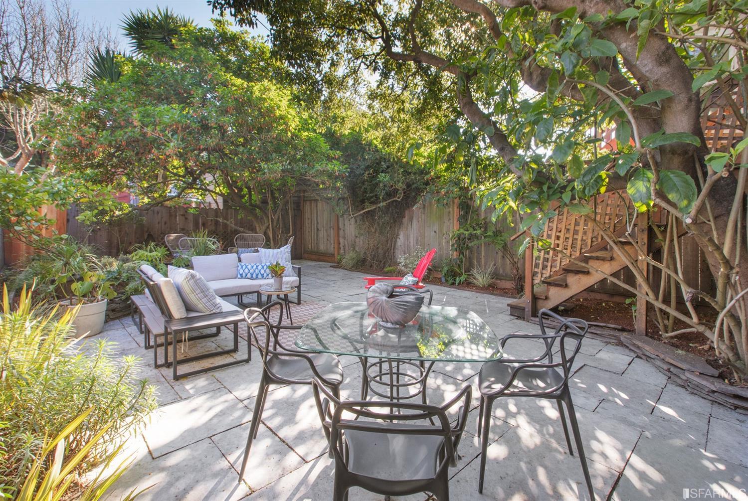 Property Photo: View of the rear patio, featuring an outdoor seating area