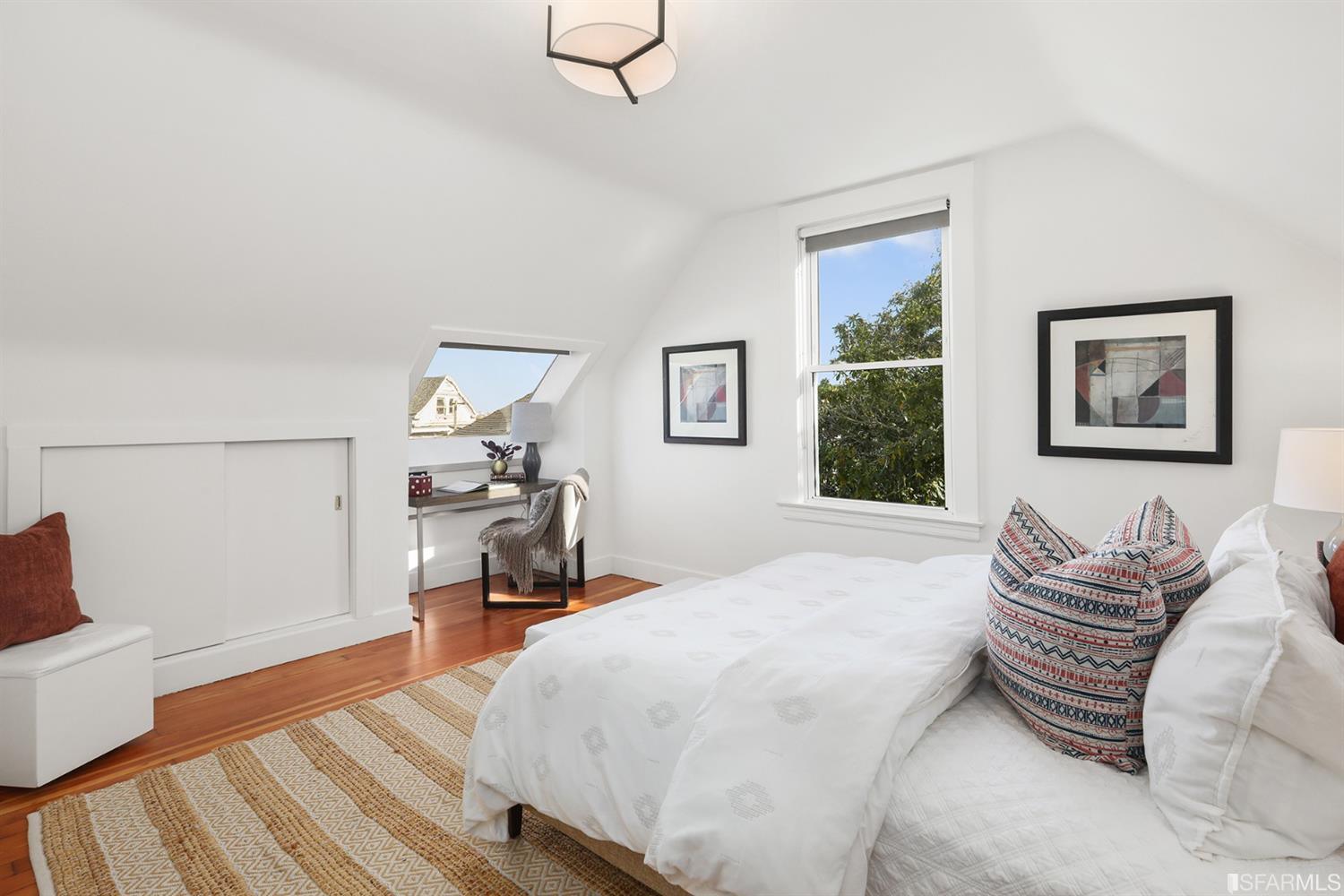 Property Photo: View of a bedroom with wood floors