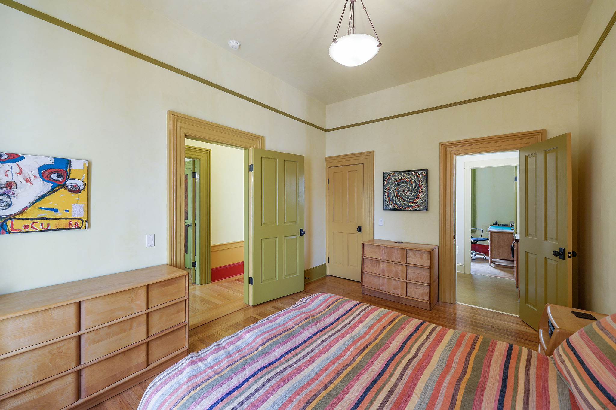 Property Photo: View of another bedroom with dual entry and wood floors