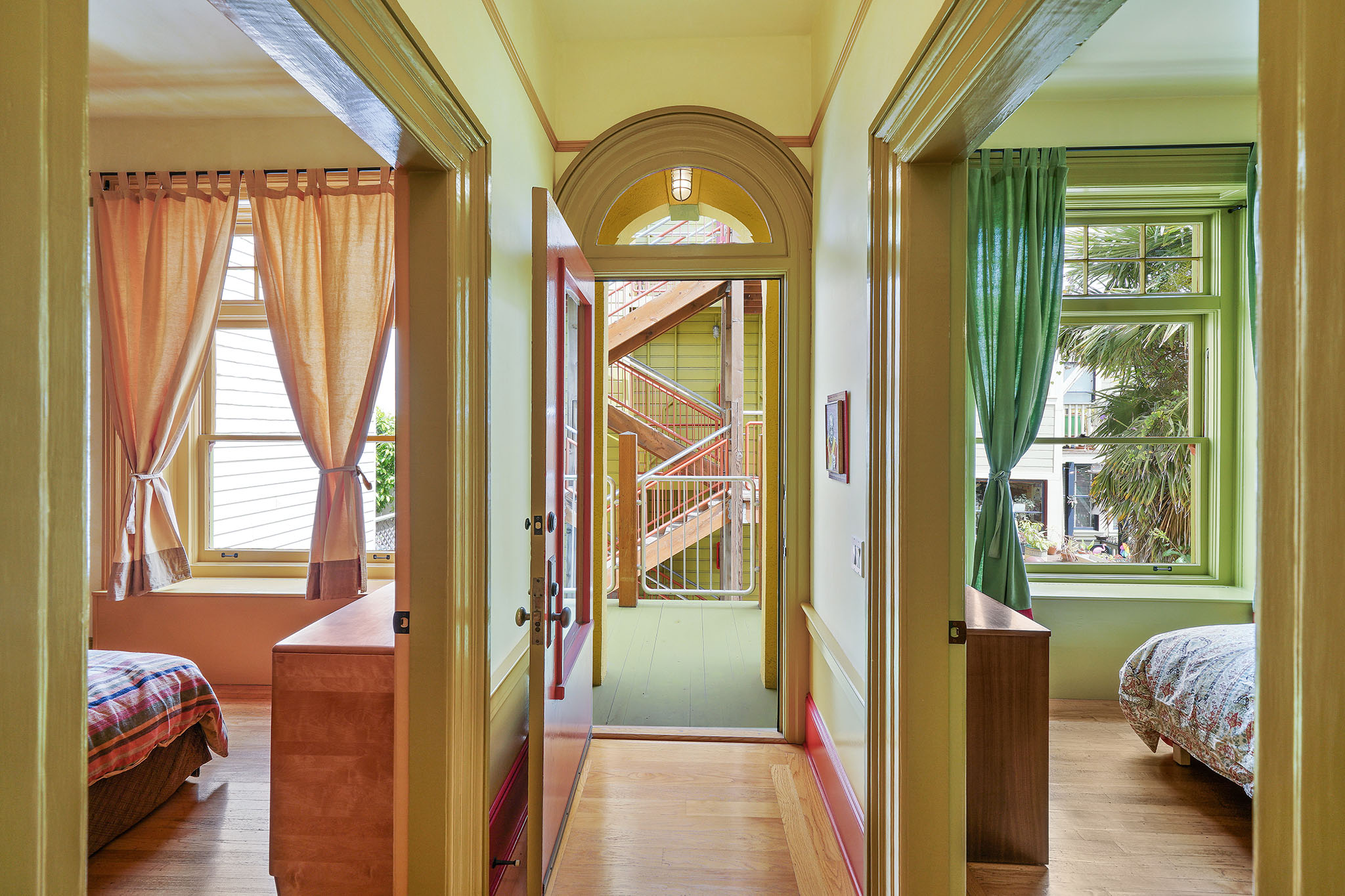 Property Photo: View of a hallway, with two adjoining bedrooms