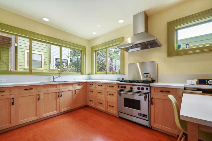 Property Thumbnail: Close-up of the kitchen, showing windows, lots of cabinets and a large stove