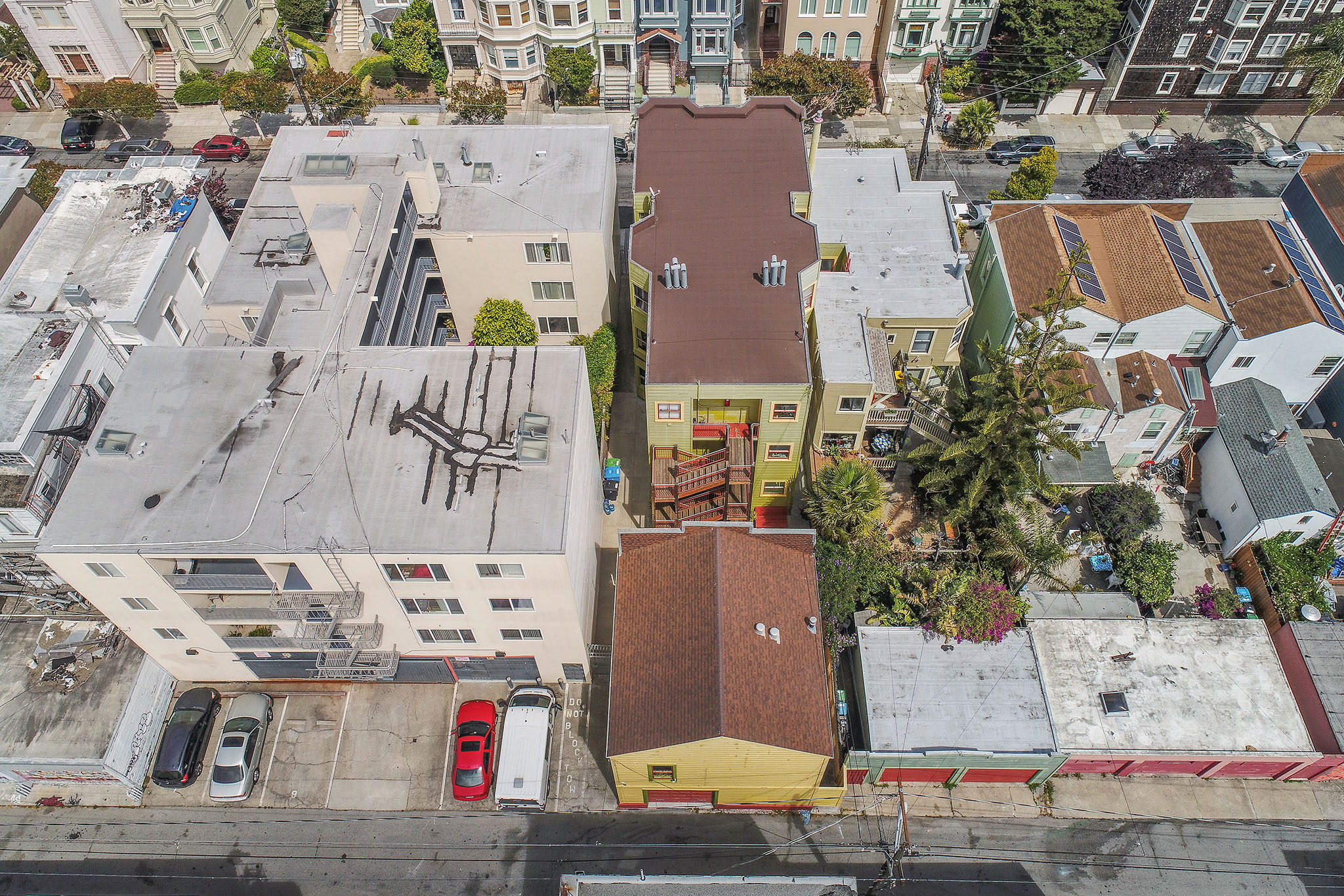 Property Photo: Aerial view of 464-468 Bartlett Street, showing the three story property and a single family residence on one lot