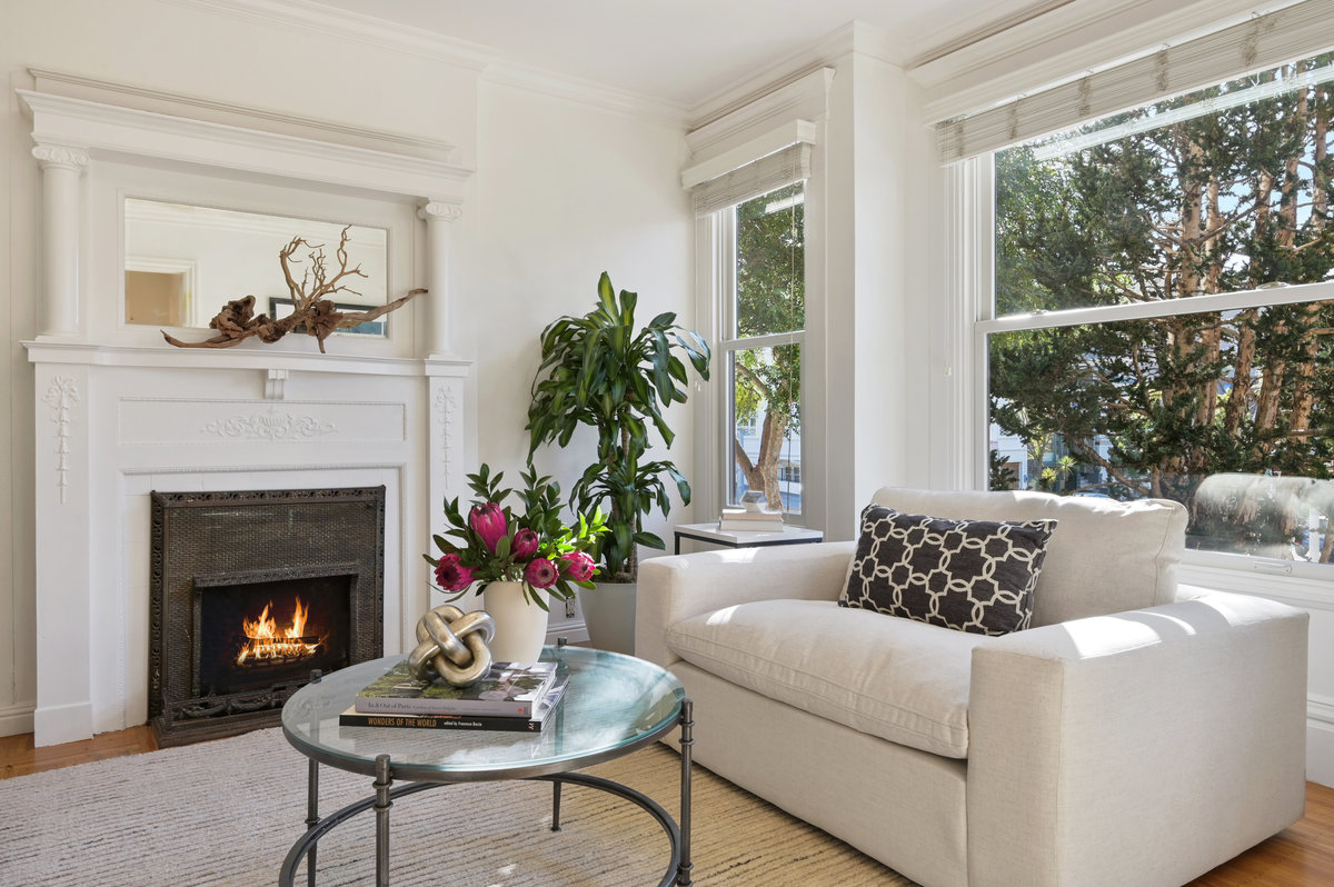 Property Photo: Close-up of the fireplace with white mantel and frame