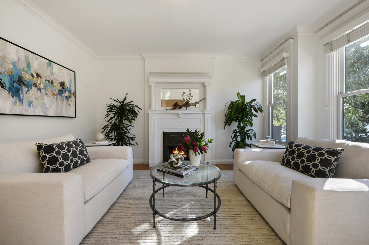 Property Photo: Long-view of the living room, featuring large windows