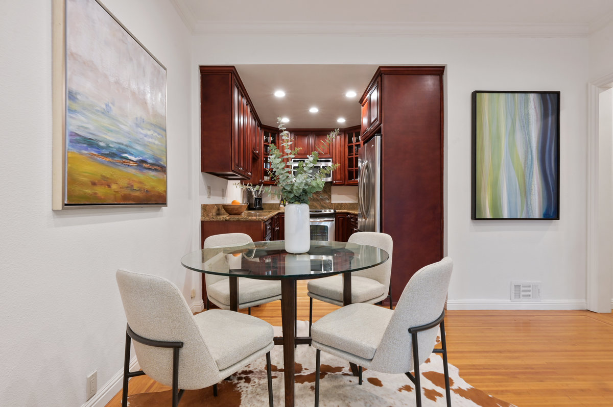 Property Photo: Lower unit dining area with wood floors