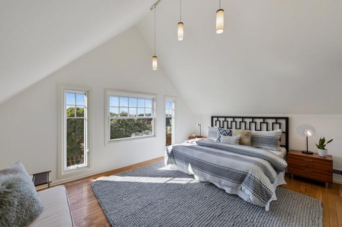 Property Thumbnail: View of the primary bedroom, featuring wood floor and plenty of natural light