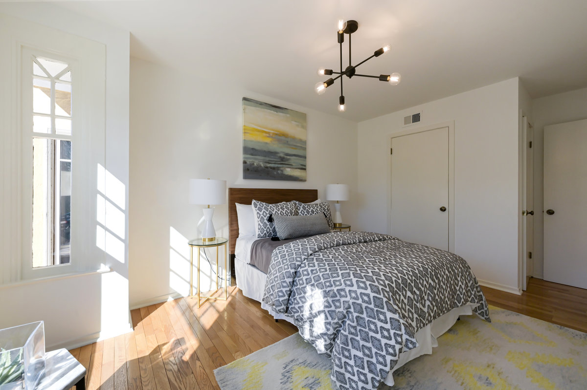Property Photo: Bedroom three, featuring wood floors