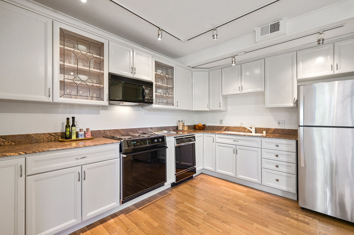 Property Photo: View of the kitchen, showing a stainless fridge 