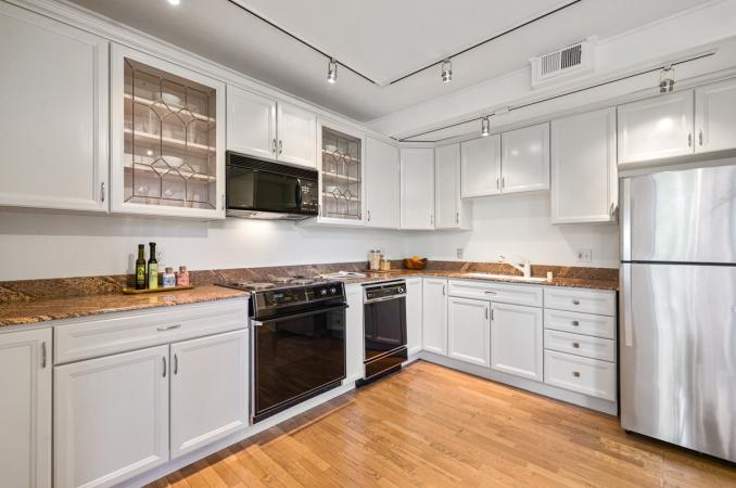 Property Thumbnail: View of the kitchen, showing a stainless fridge 