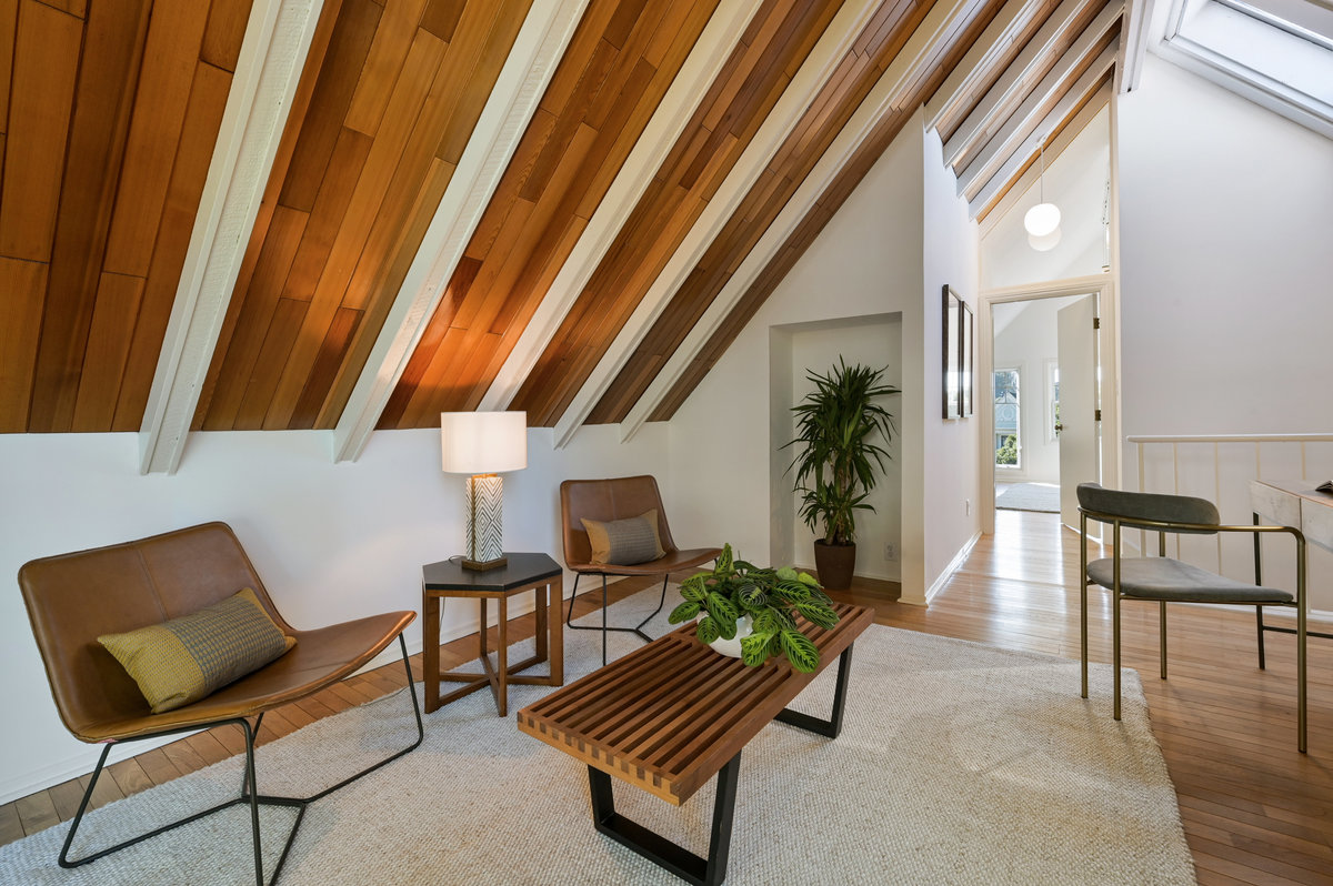 Property Photo: Close-up of the top-floor living area and the beautiful wood ceiling