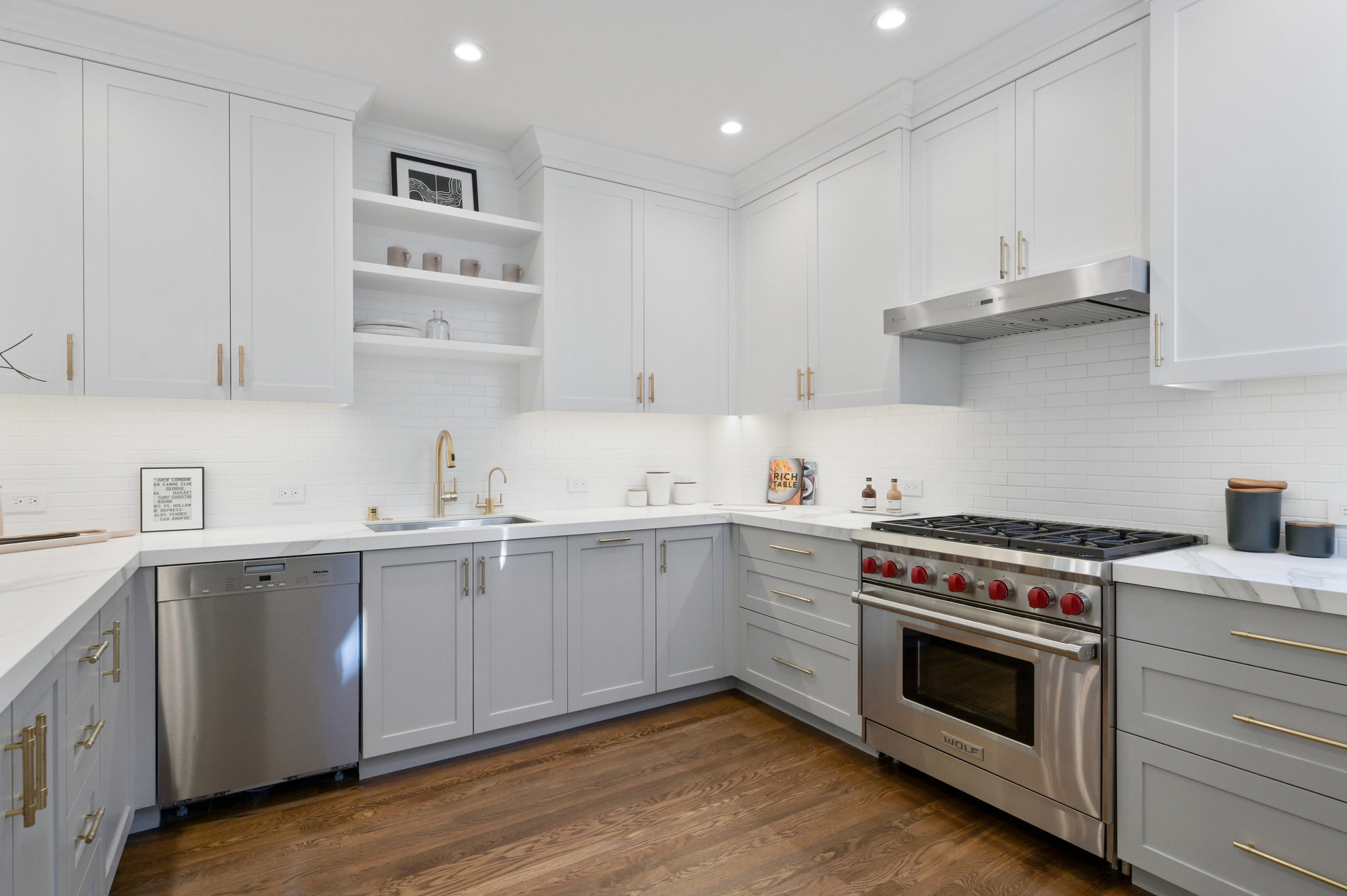Property Photo: Kitchen view, showing the stainless stove and lux cabinets