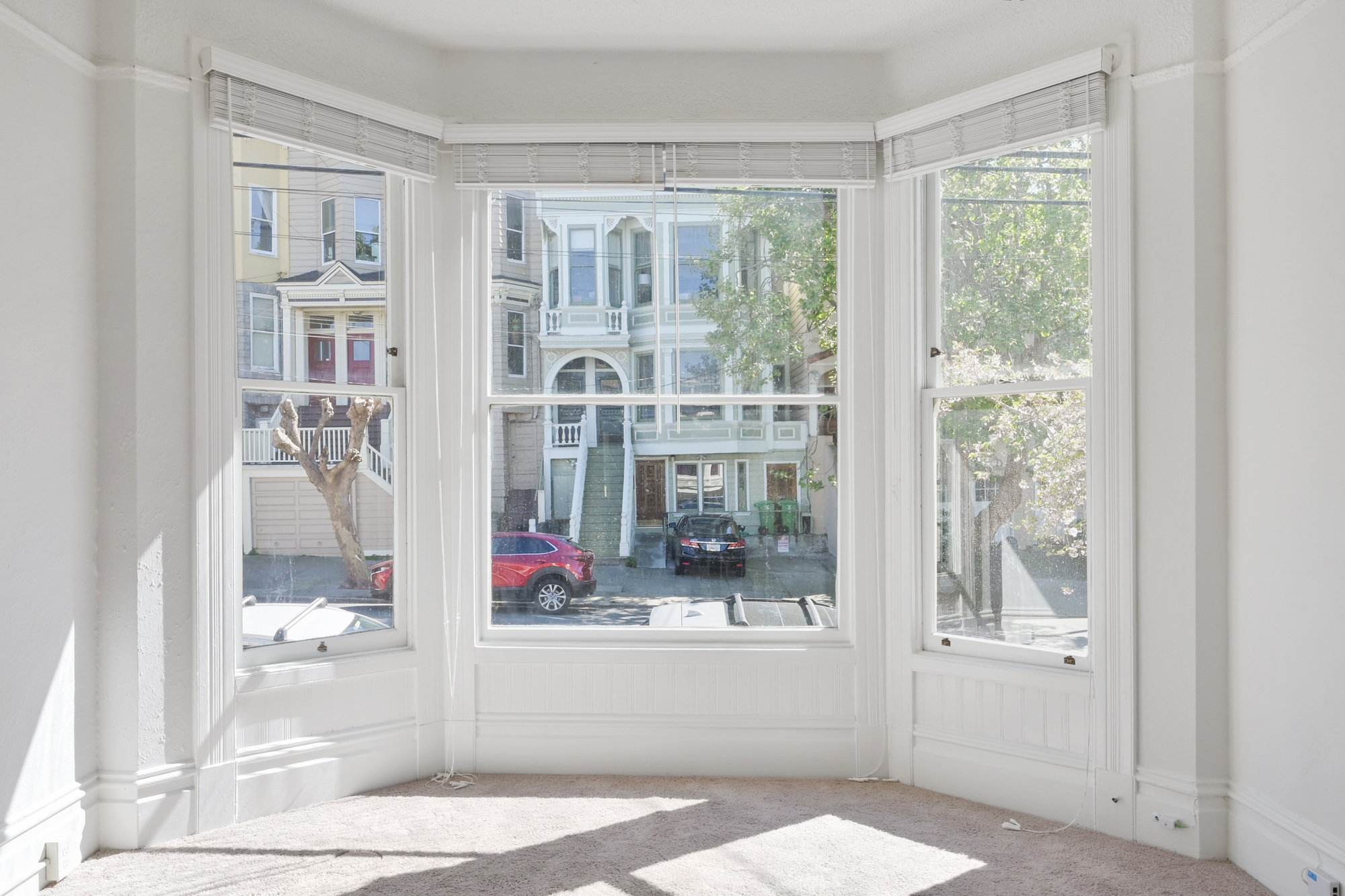 Property Photo: View of a bay window overlooking a street