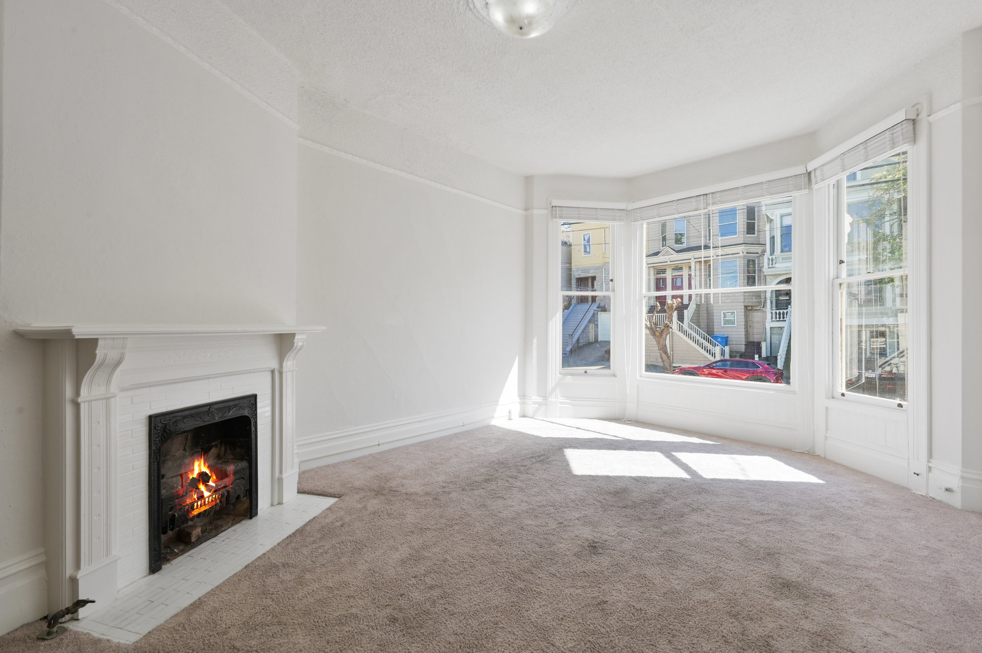 Property Photo: Side-view of a living room with carpet