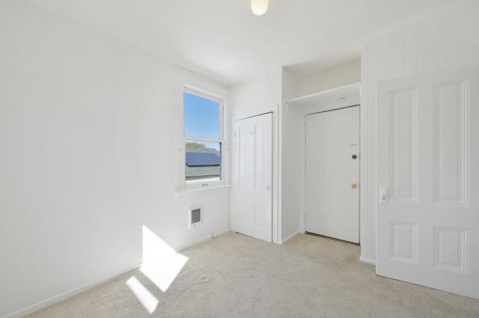 Property Thumbnail: Room with two closets and a large window