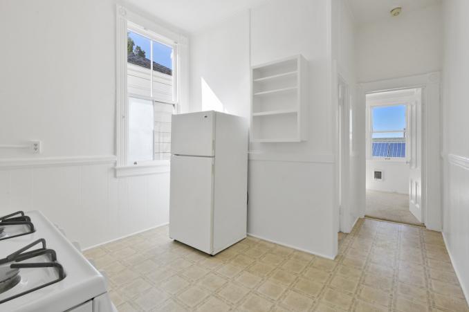 Property Thumbnail: View of a kitchen, showing a fridge and windows