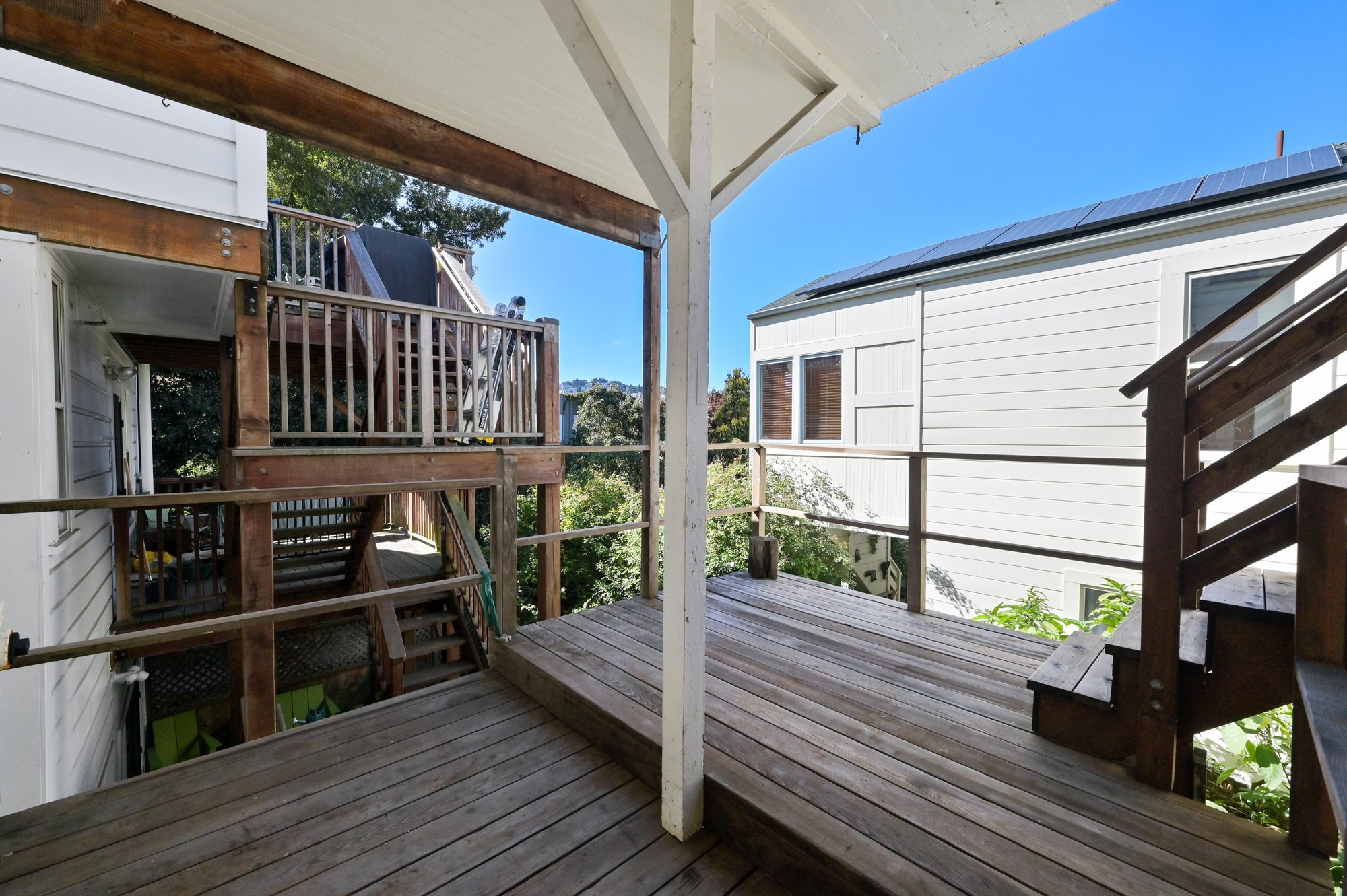 Property Photo: Deck with overhang and steps leading up