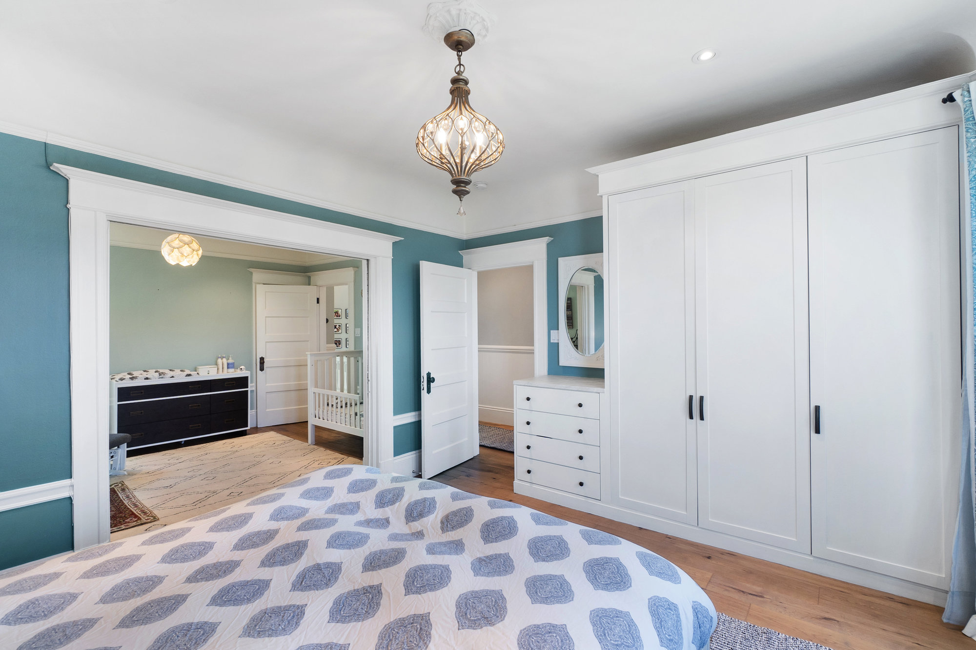 Property Photo: View of the primary bedroom with the pocket door open