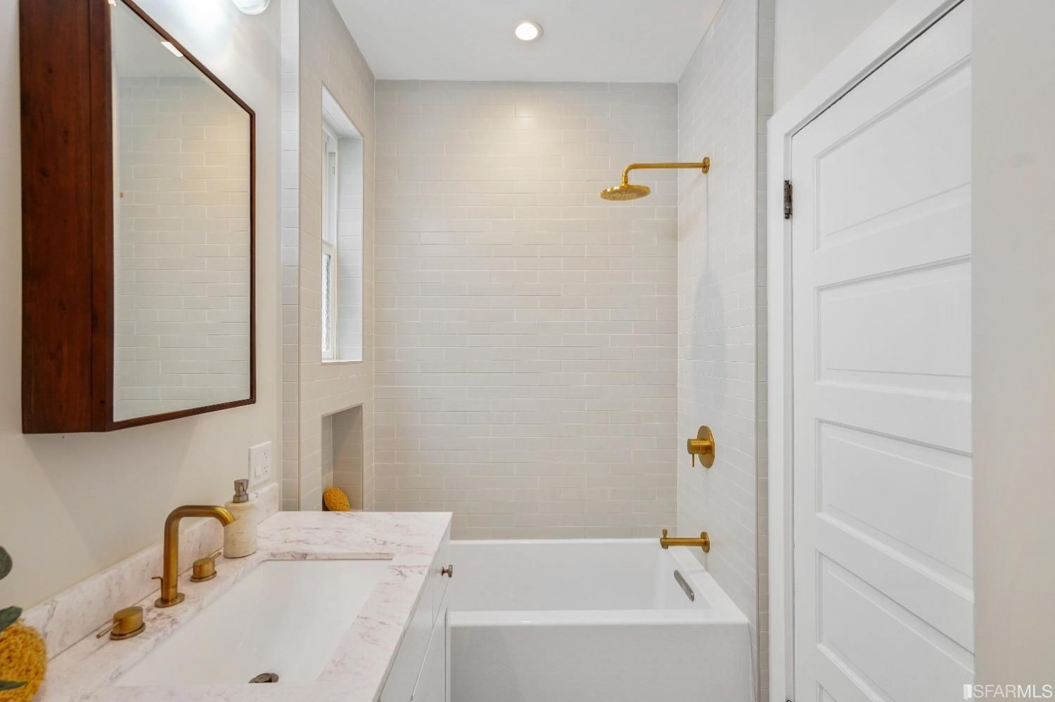 Property Photo: View of a bathroom with large tub and high-end fixtures