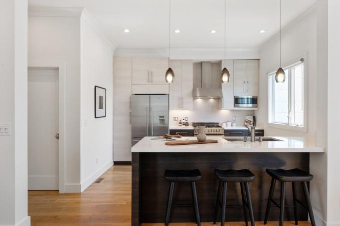 Property Thumbnail: View of the kitchen island with seating, showing pendant lights above