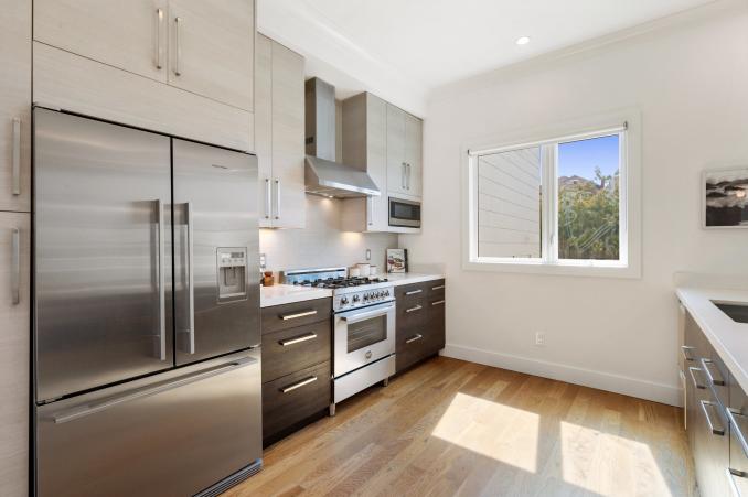 Property Thumbnail: View of the kitchen, showing a large stainless refrigerator and window