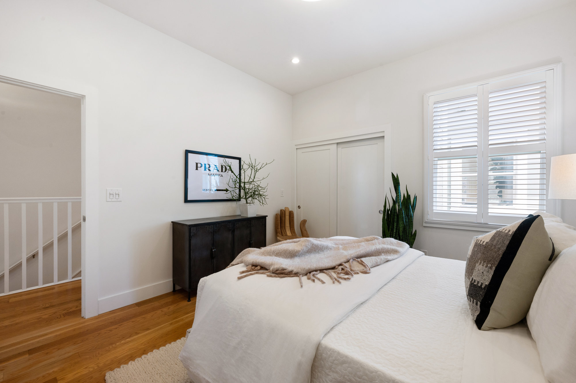 Property Photo: Bedroom two, showing wood floors and recess lighting