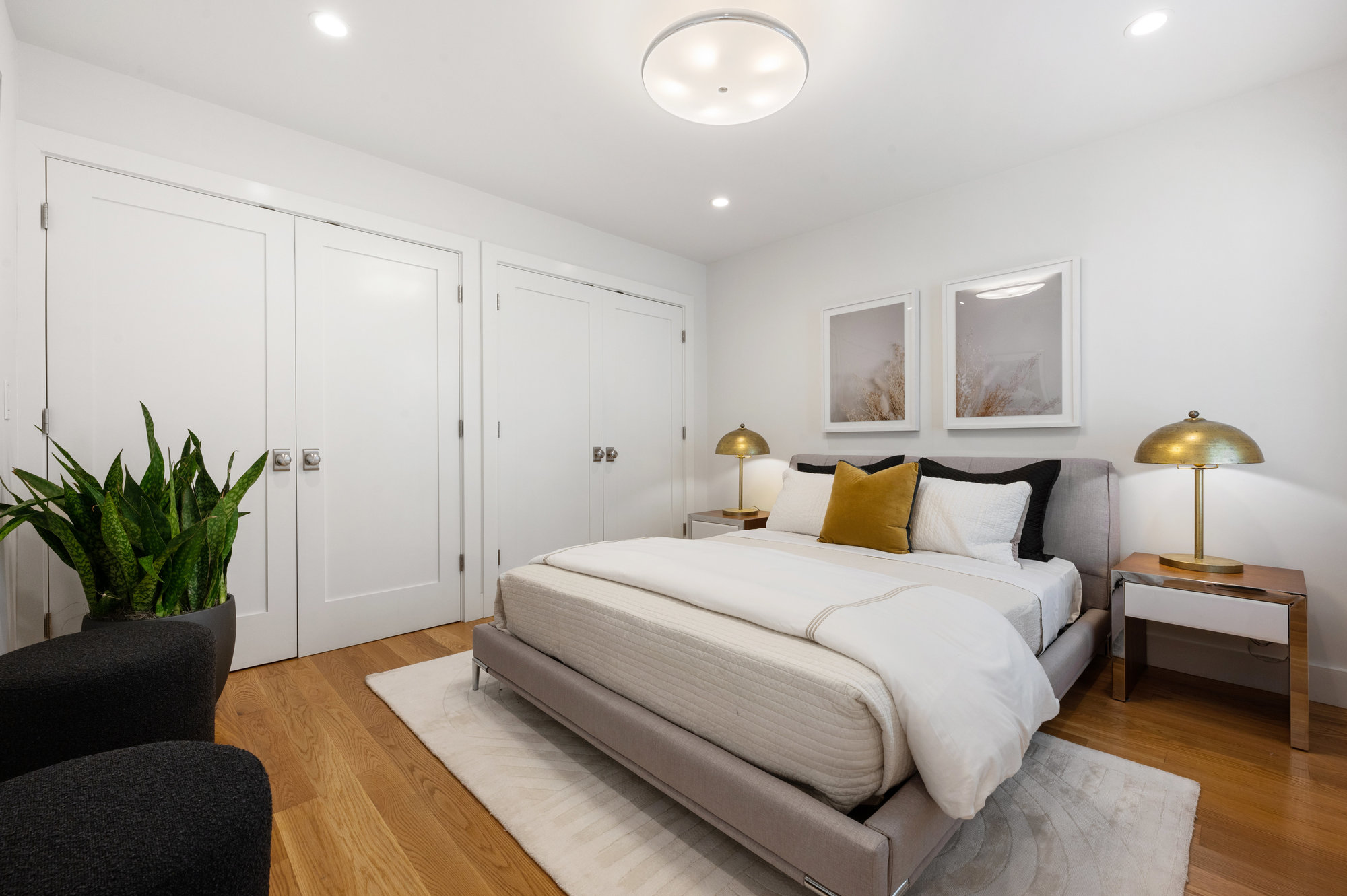 Property Photo: Bedroom four, showing large double closets and wood floors 