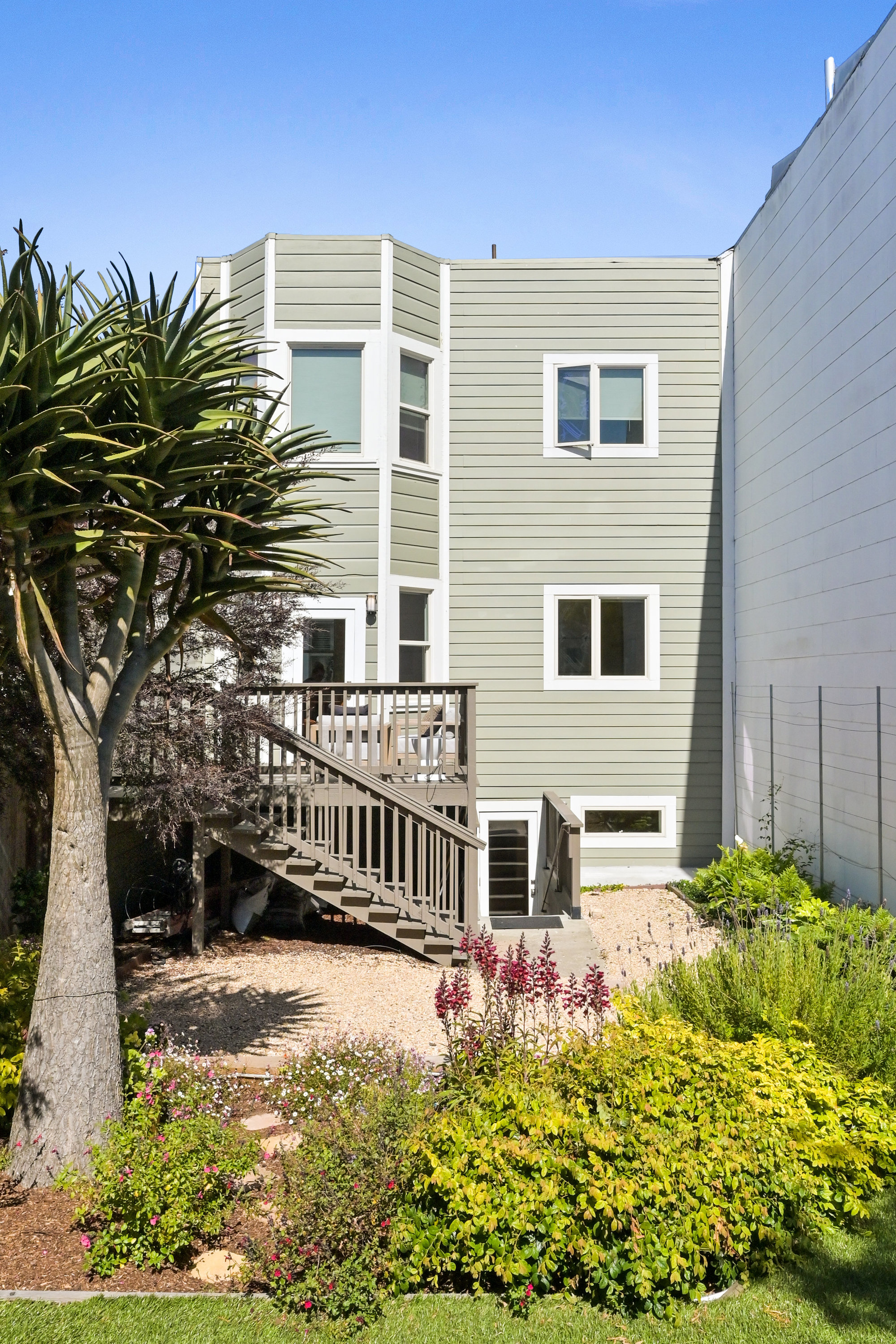 Property Photo: Rear exterior view of 719 18th Avenue, showing a multi-level home