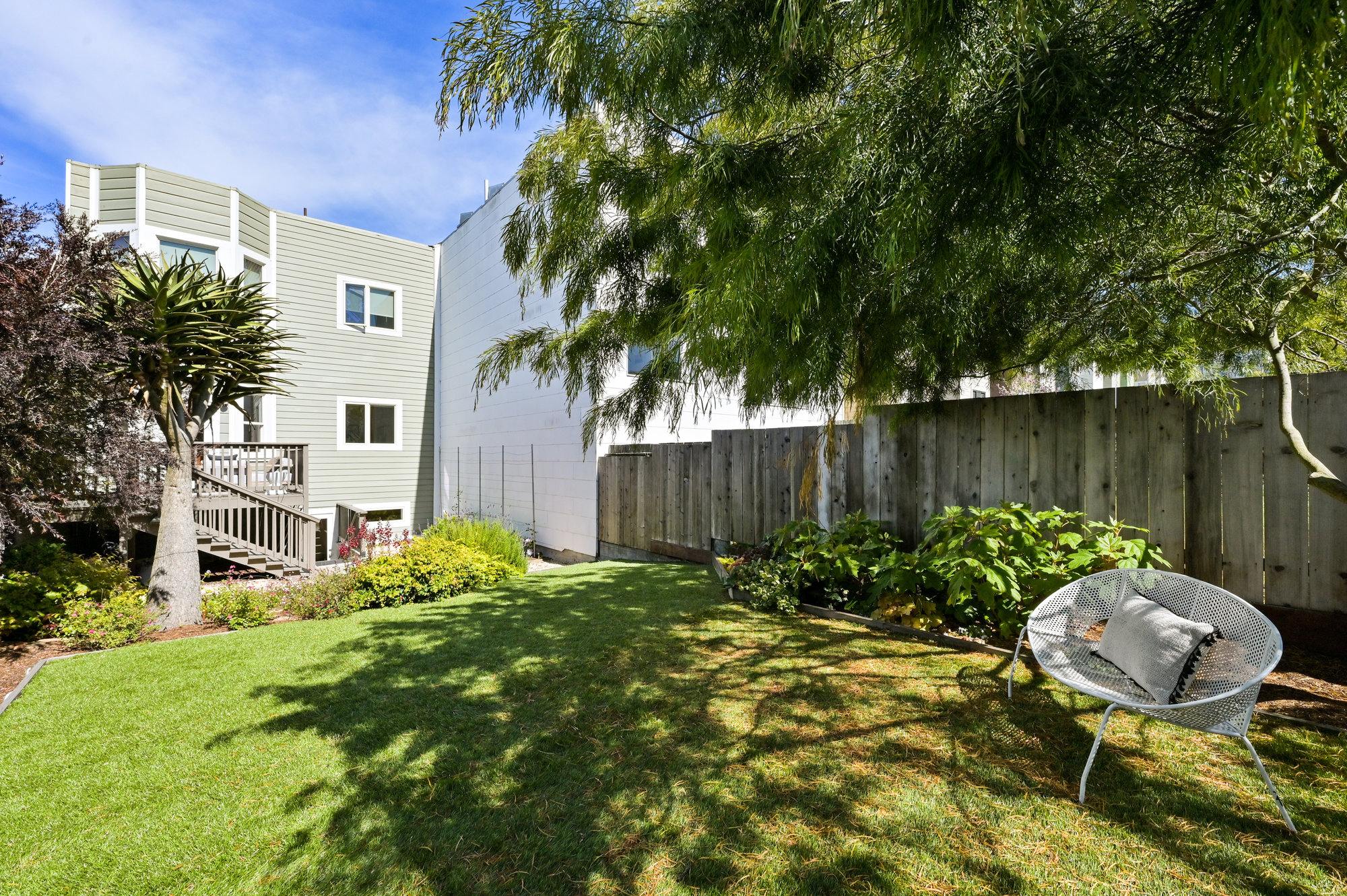 Property Photo: View from the rear yard, showing the exterior facade of 719 18th Avenue