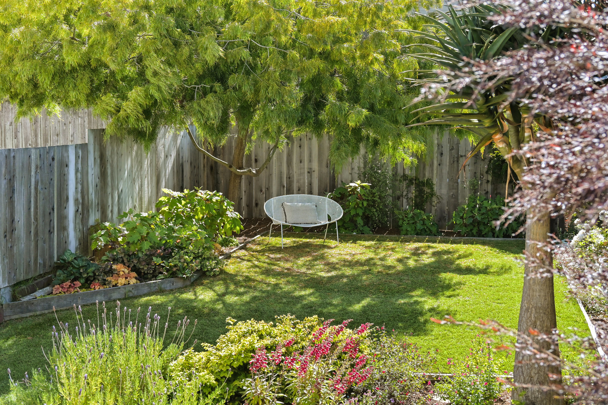 Property Photo: Close-up of a shaded outdoor sitting area 