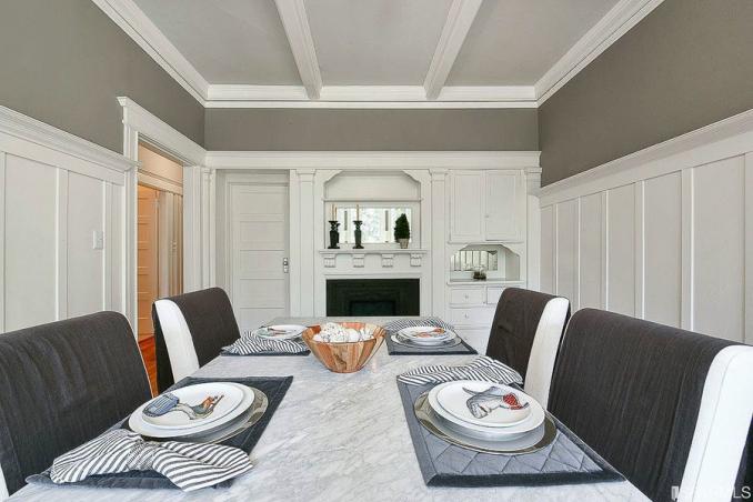 Property Thumbnail: View of another formal dining room, showing white boxed ceilings, wainscoting, and a fireplace