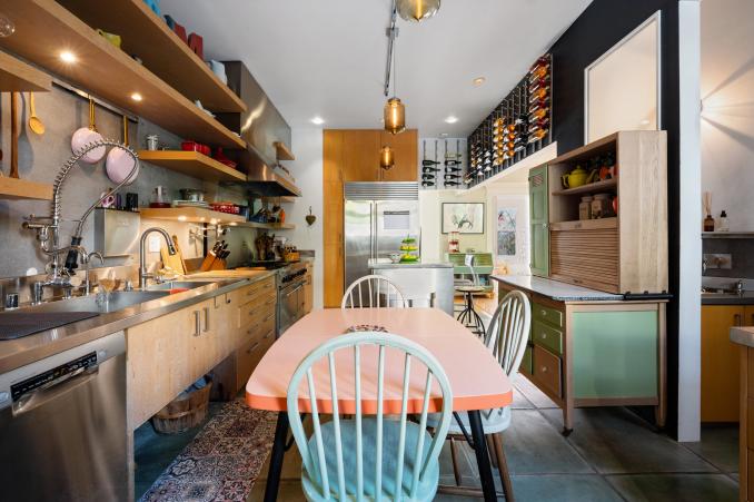 Property Thumbnail: Kitchen with open shelving, pendant lights and an eat-in dining area