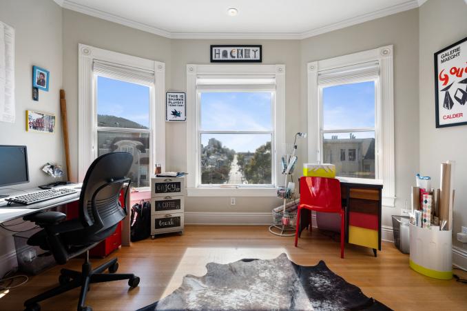 Property Thumbnail: View of a room used as an office, featuring bay windows