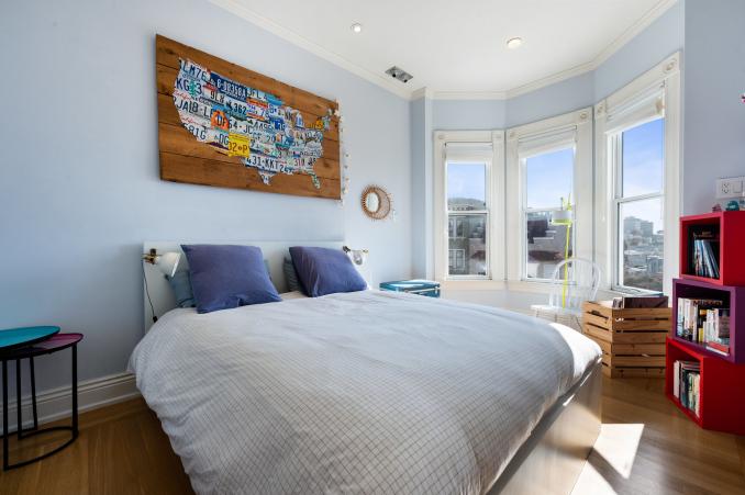 Property Thumbnail: View of a second bedroom with large bay windows with wide woodwork